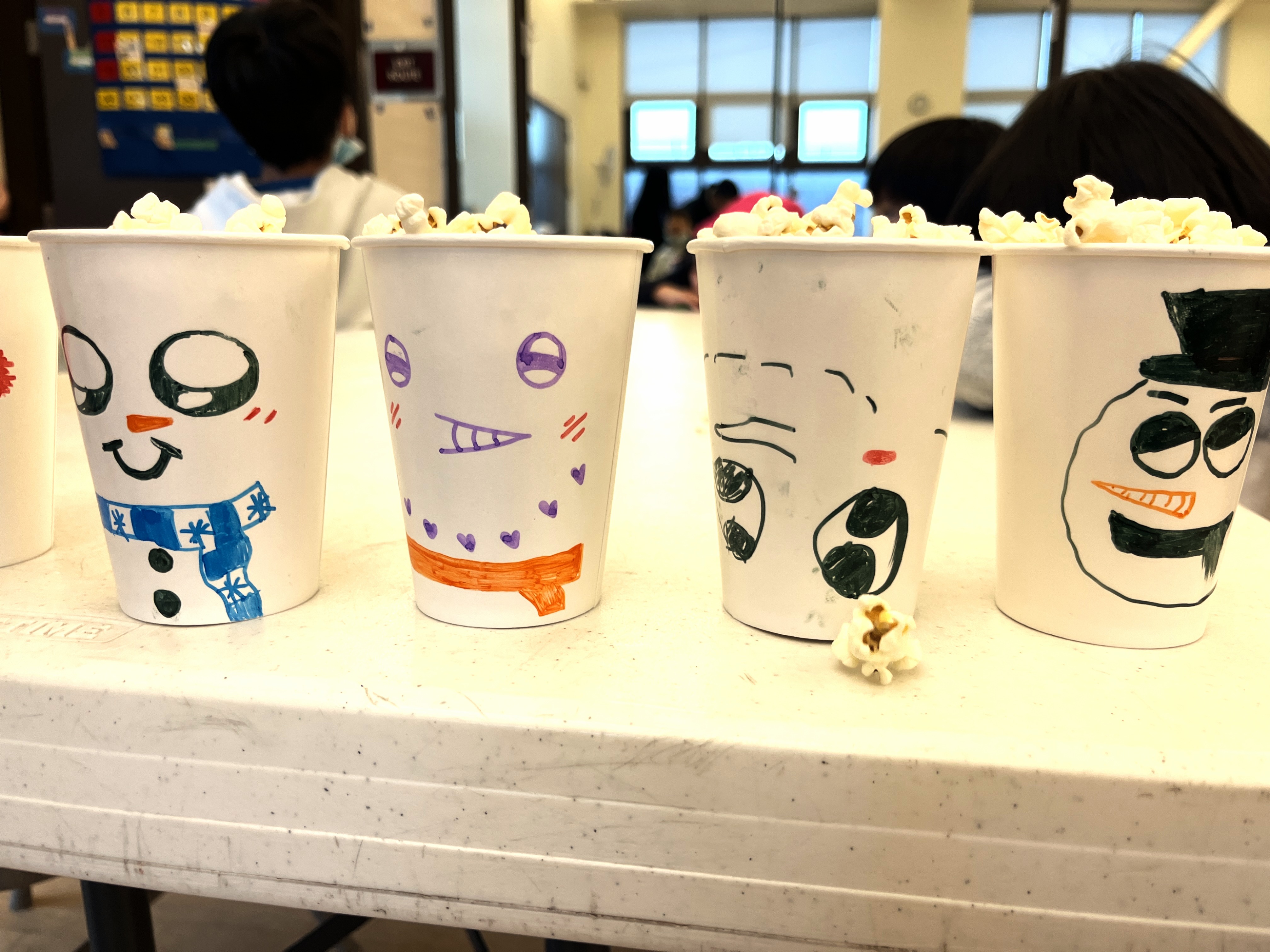 Snowman drawn on cups