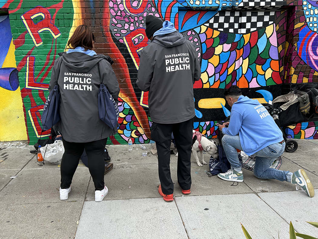 street team helping a client on the street