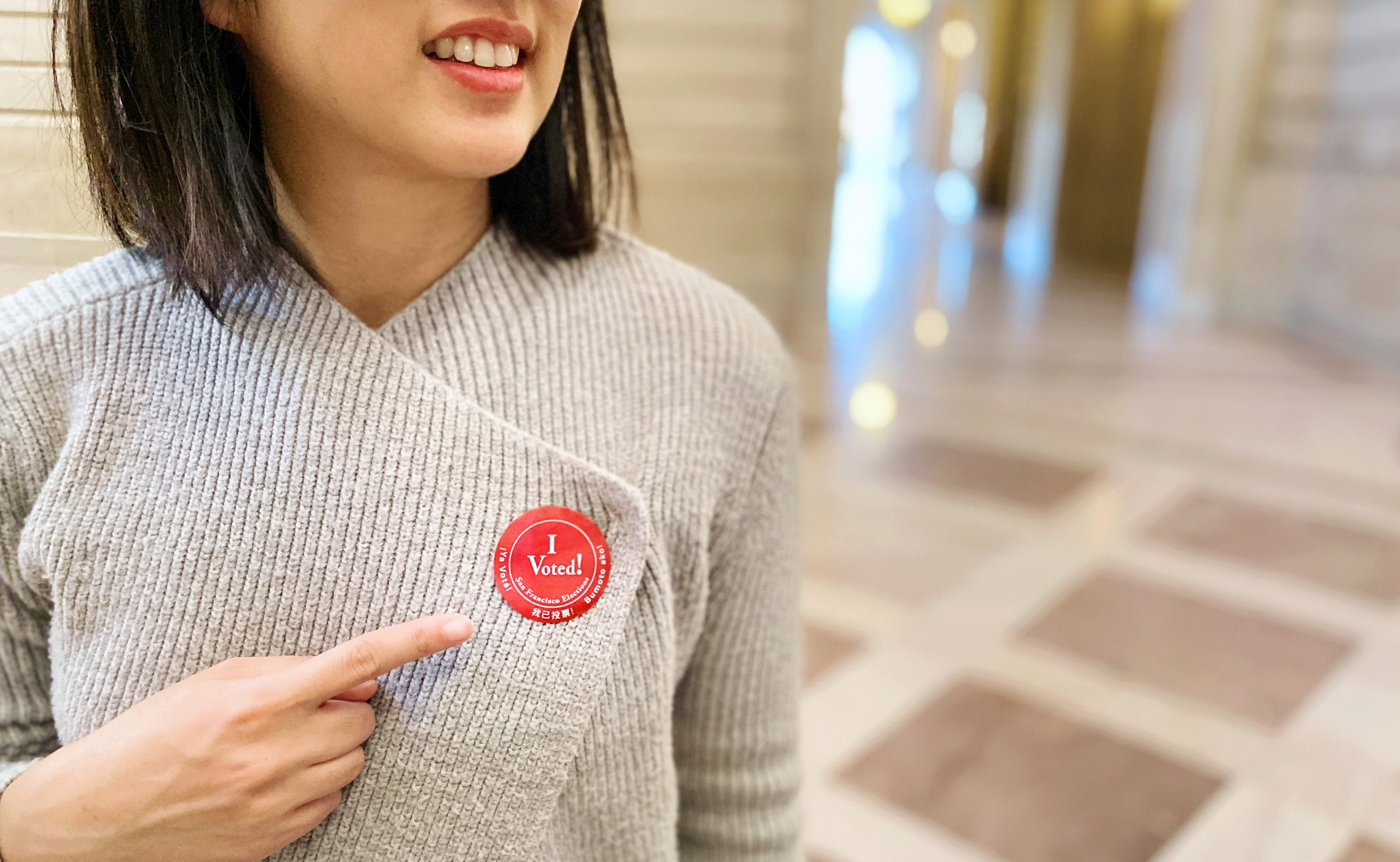 woman wearing an I voted sticker